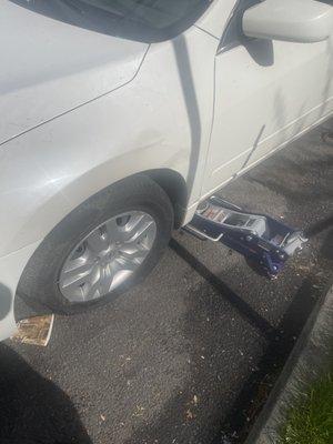 Stranded motorist with flat tire and stripped lug nuts