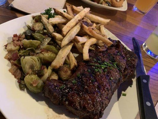 Ribeye steak, Brussels sprouts, and fries