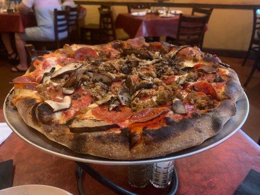 Delicious pepperoni, sausage & mushroom pizza.