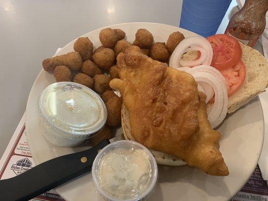 Fish sandwich with fried mushrooms