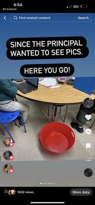 Kids in classroom next to buckets filled with mold