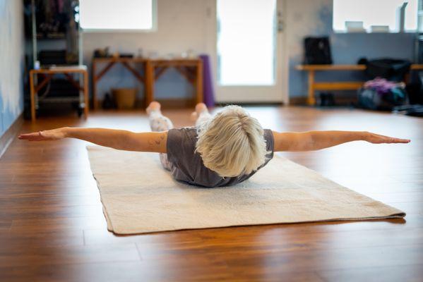 Salambhasana pose strengthening the back body.