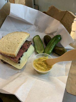 Half pastrami with Swiss cheese. Homemade pickles were amazing too!