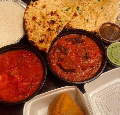 Delicious garlic naan, basmati rice, massive samosas, shrimp vindaloo & an eggplant dish. All so, so good!!!