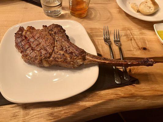 My medium rare tomahawk bone in ribeye.  Cooked upstairs at a private diner.