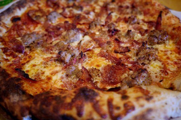 "Meat Lovers" sourdough pizza - San Marzano tomato sauce, mozzarella, pepperoni, bacon, sausage