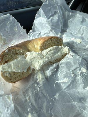 A bagel, completely ruined with way too much cream cheese, making it completely unenjoyable.