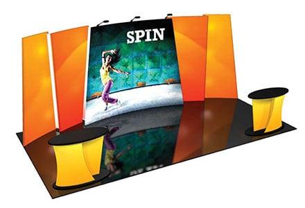 Portable displays are made using different graphic materials such as full color fabric.