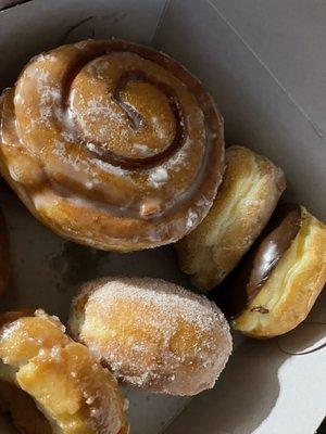 Giant cinnamon roll (always that size), old fashion, sugar coated jelly filled, chocolate donuts.