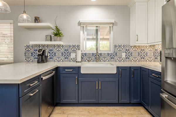 These floating shelves help open up  this bright California Coastal kitchen!