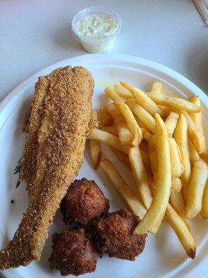 Whole catfish, fries, and hushpuppies