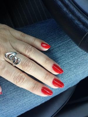 Gel nails in Coca Cola red.