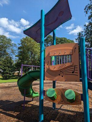 Playground with toddler and older kid play and swings with parking at Waffle House