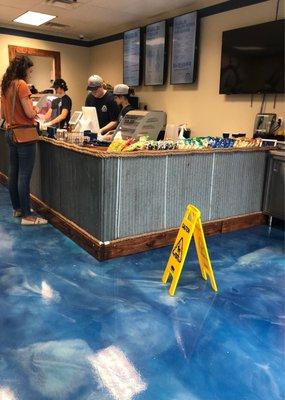 Cool nautical theme to Lakeside Subs. Flooring has a blue water appearance