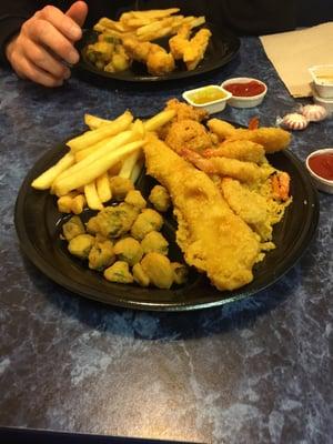 Shrimp Fish hush puppies and fries & okra.  Yumm