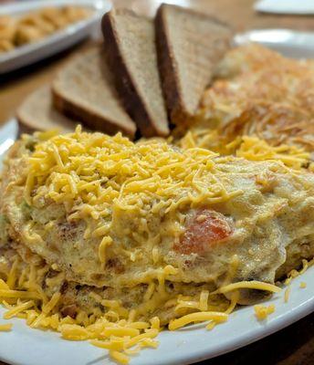 Trash can omelette with hash browns and toast