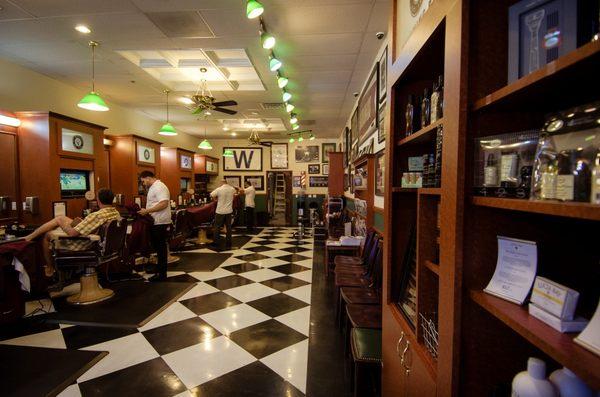 This is what I consider a old fashion but contemporary shop with barber coats, open floor and waiting chairs