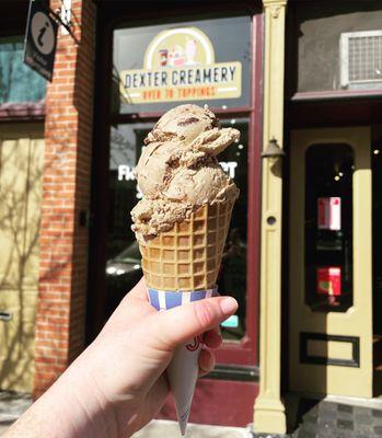 Double scoop waffle cone with peanut butter brownie bits ice cream