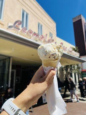 Single scoop Honey Almond Cream on a cake cone