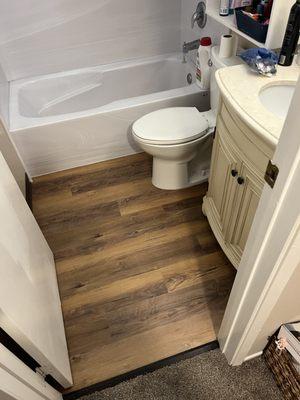 Waterproof vinyl plank flooring installed in bathroom