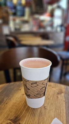 pink chai with oat milk -- hot