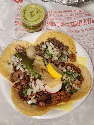 Tacos de Carnitas, Asada, Pastor y Tripas (clockwise)