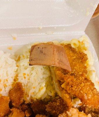 Chicken katsu.  Shocked to find a dirty, bloody bandaid on top of my food.