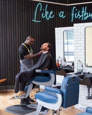 Justice-impacted barber performing a high quality haircut, fade and beard trim.