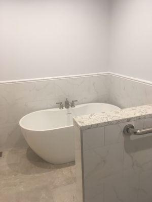 Kohler soaker tub next to shower