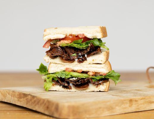 Crispy Shroomacon, fresh lettuce, a juicy tomato slice on your choice of bread.