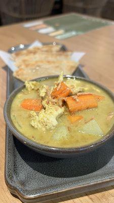 Close up of the yellow curry in roti canai