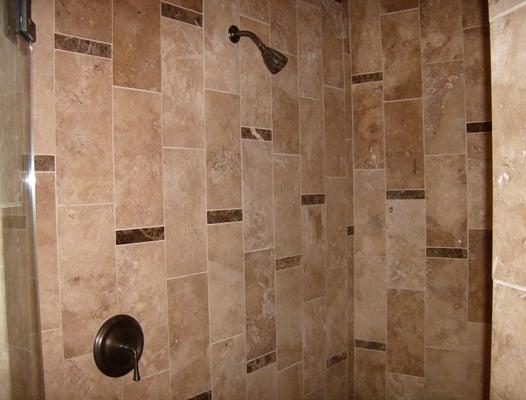 Another shower remodel. Actual install. Stone tile with granite inserts.