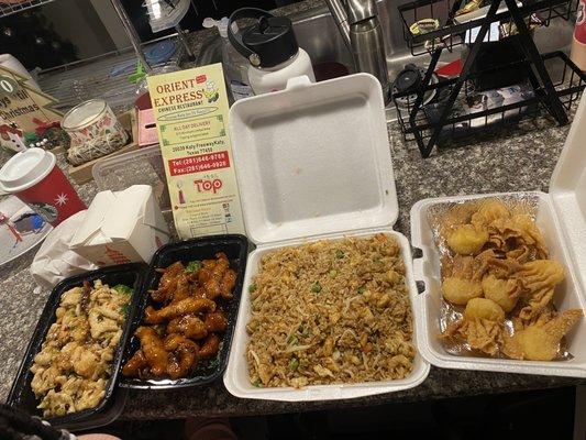 when I got here is cream Crab Puffs Orange Chicken chicken, Fried Rice shrimp, and chicken