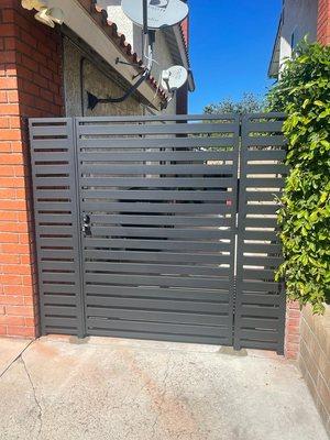 New side entry gate metal tubing modern look in lake forest by OC Gates.