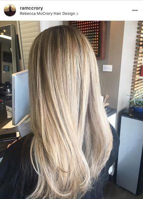 Bright blonde with shadowed roots.