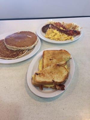 Hungry breakfast top 2 plates, not so hungry breakfast sandwich on the bottom