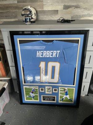 Signed Justin Herbert jersey in one of a kind frame.