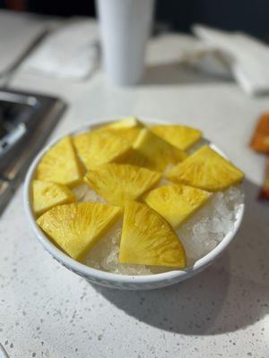 Emily graciously placed our pineapples on a bowl of ice!