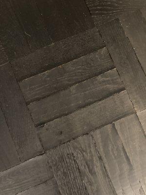 ANOTHER WOOD TILE NEAR WHERE CHAIR WAS CLEANED