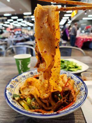 The  Stir Fried Cumin Lamb Hand-ripped Noodles are super long that you're guaranteed longevity for the Lunar New Year.