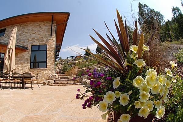 Planters with seasonal color are a great way to accent hardscapes in your landscape design.