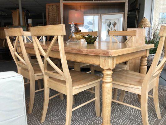 Solid wood, natural stain table for 6 w/two extensions.