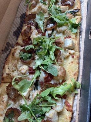 Garlic butter drizzle as base, vegan cheese, suasage, chicken, bacon, topped with arugula more garlic drizzle & olive oil - delicious