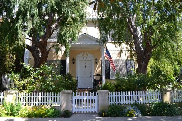 This charming 2 bedroom apartment cottage feels more like your own home with a private front yard.