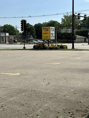 Their corner business sign with lovely flowers.