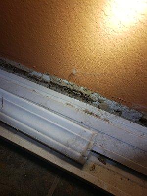 Termite damage very evident here. Baseboards were laying in front of that area.