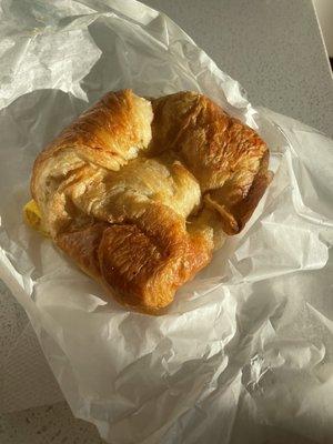 Croissant sausage egg and cheese sandwich