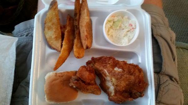 Two piece chicken box, breast and wing, taters, slaw and roll.