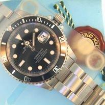 We have the most popular rolex style, the black submariner, pre-owned in stock in mint condition!