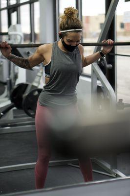 One of our members working out using our smith machines